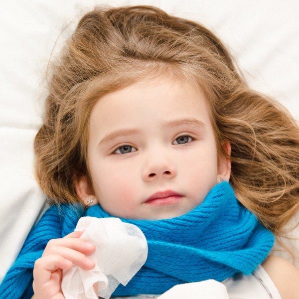 Young girl in bed with the flu