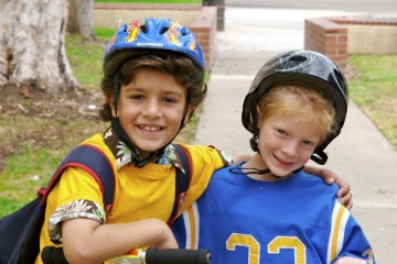 Two young boys wearing helmets