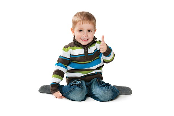 Young boy giving the thumbs up sign