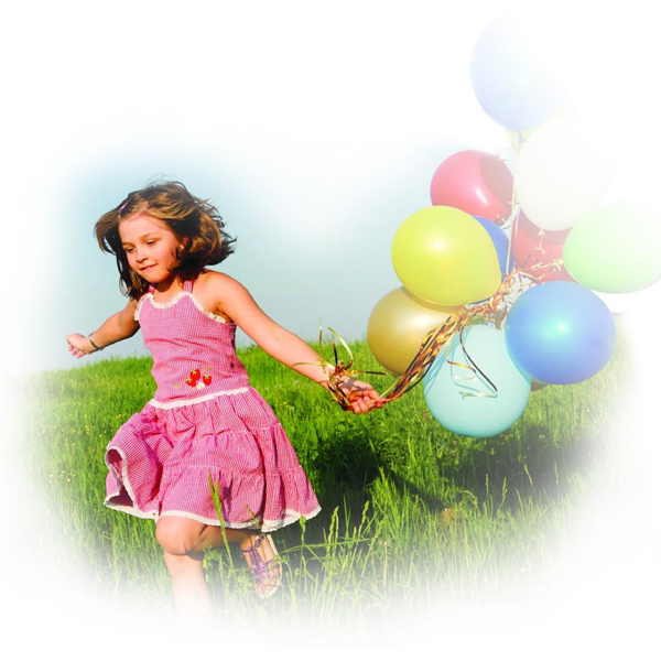 Girl running outside with colorful balloons