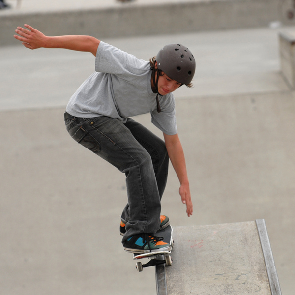 Boy on a skateboard wearing a helmet