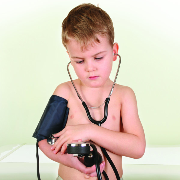 Young boy taking his own blood pressure