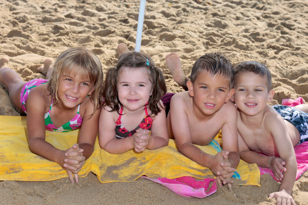 Young kids on the sand at the beach