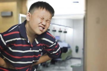 Boy experiencing severe pain