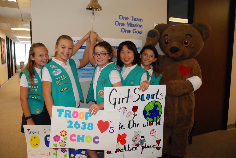 Girl Scout Junior Troop 2638 of San Juan Capistrano rings with bell with Choco