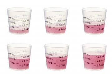 Medication cups showing dosage levels