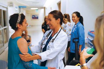 Physician with teen patient