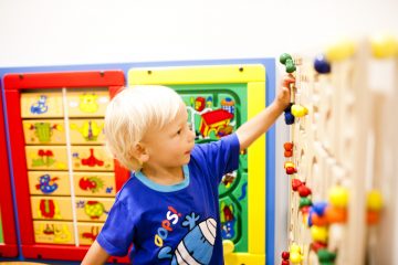 Young boy playing with wall games