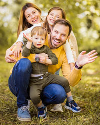 family hugging outside