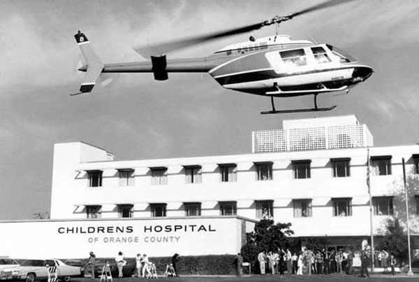 Helicopter hovering over original CHOC hospital building.