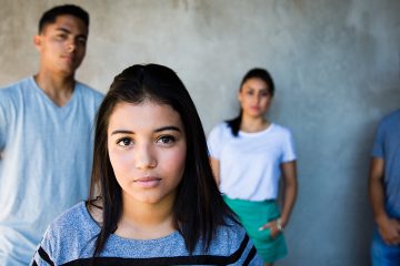 three teens looking serious