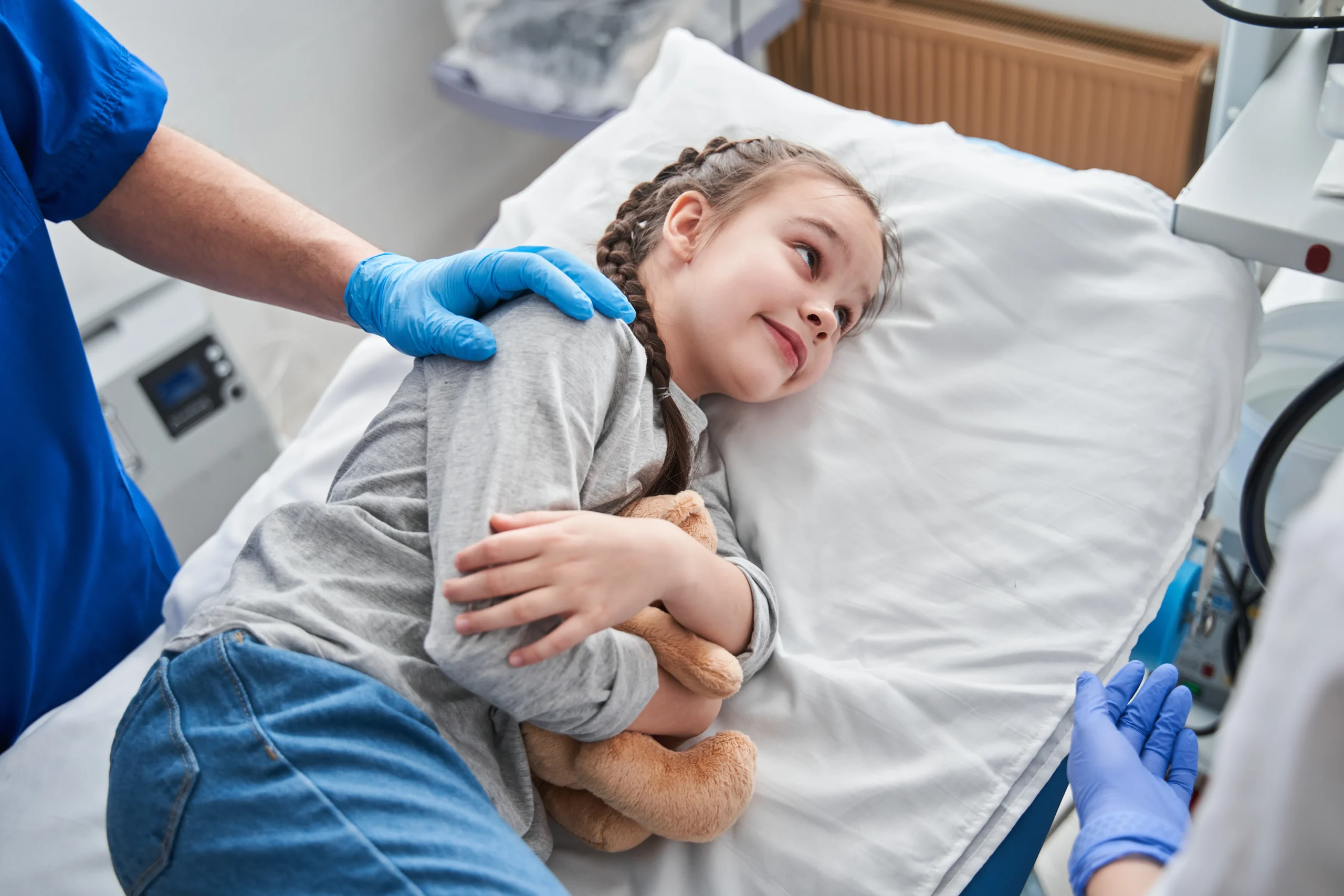Girl laying in hospital bed