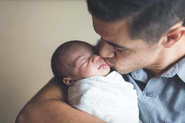 Dad holding infant