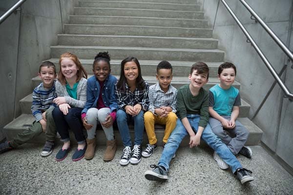 Kids sitting together and smiling