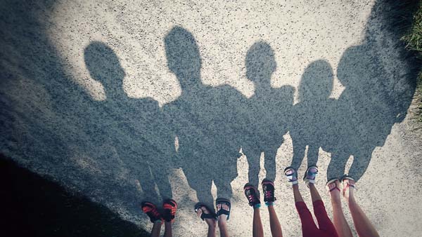 Shadows of a group of kids