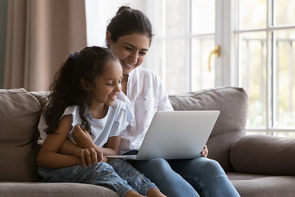 Child and mom on telehealth appointment