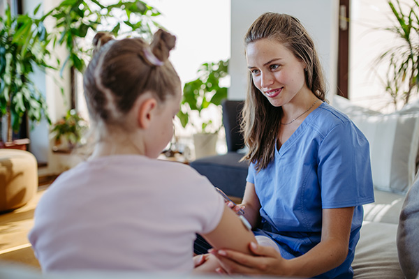School nurse talking to child