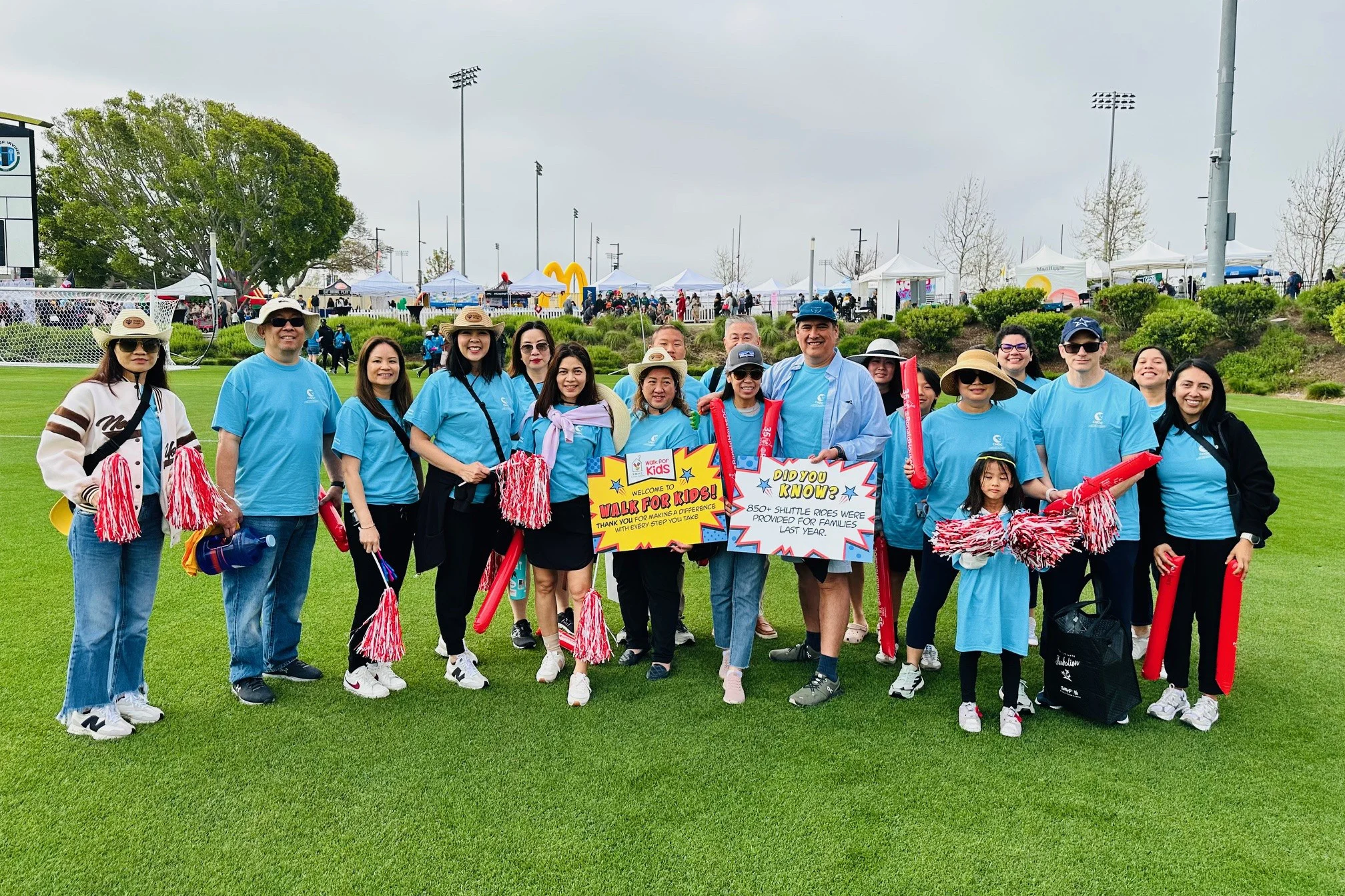 Choco's Community Action Team volunteers by cheering on participants at a community walk