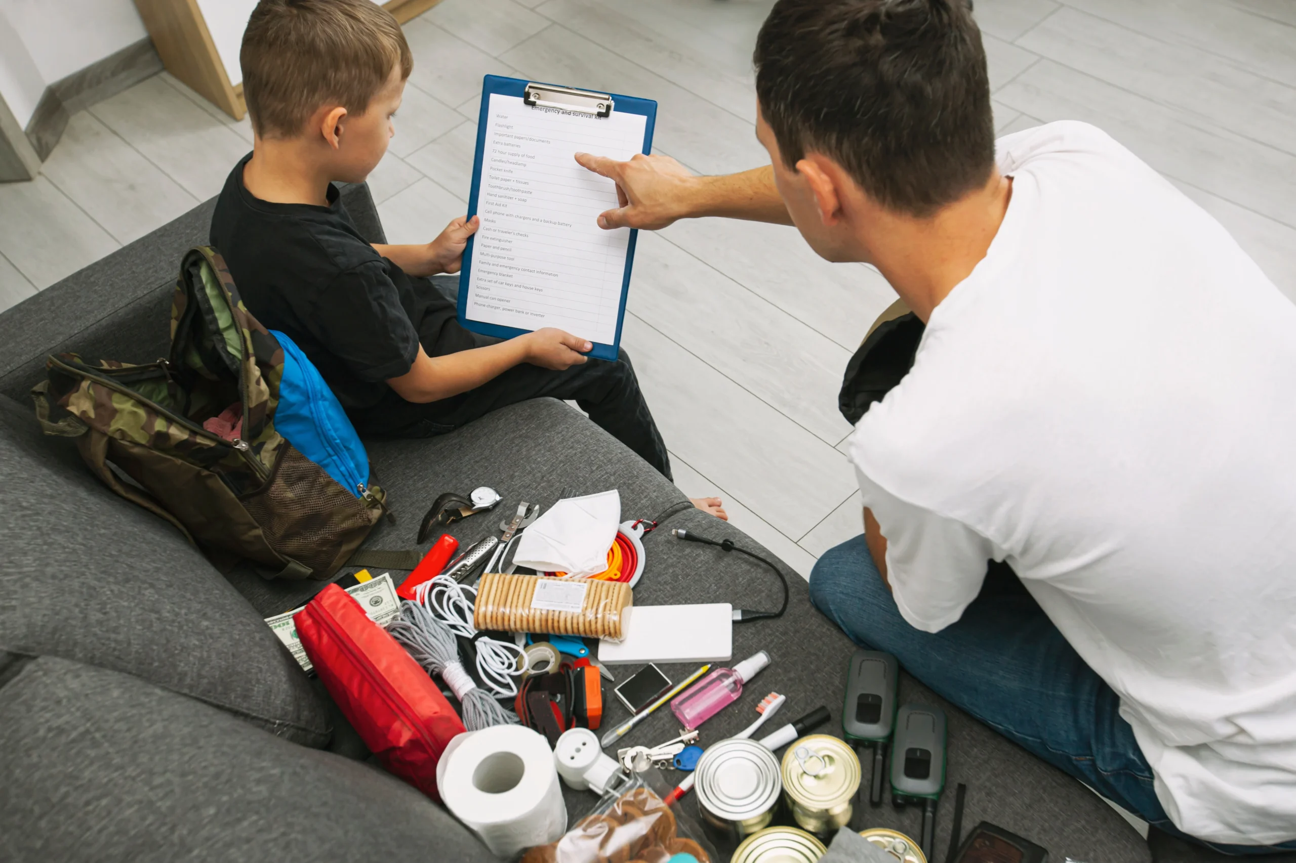 Dad and son creating emergency kit