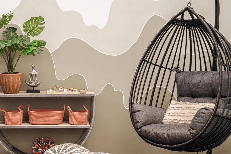 CHOC Wellspace - hanging comfortable chair, shelf with resources, calming space