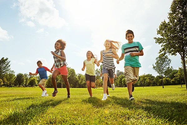 Children running in field