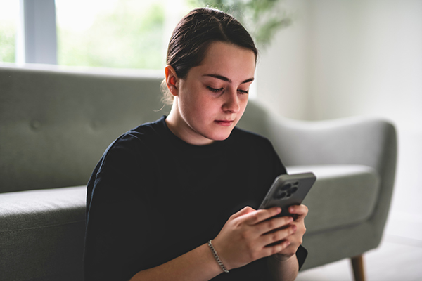 Teen looks at phone