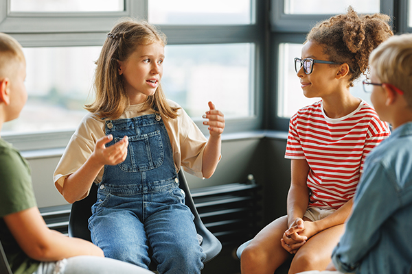 Child talks to other classmates