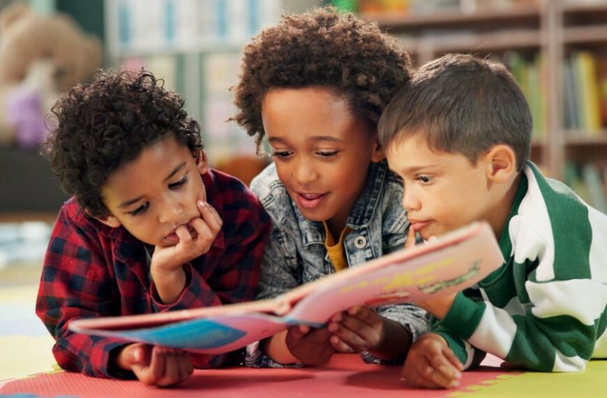 Students look at book together