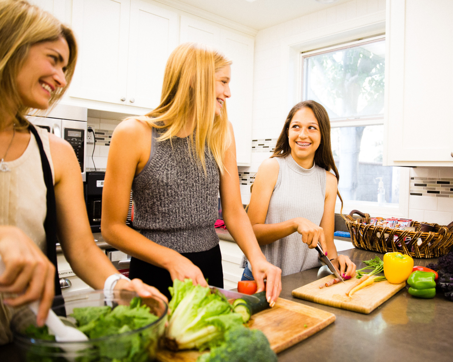 family preparing a meal together in a kitchen